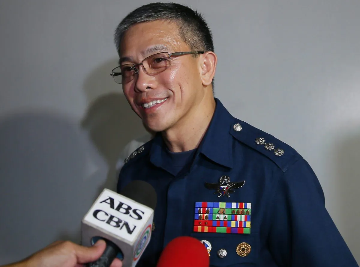 Spokesman Col. Restituto Padilla talks briefly with the media about the latest video of two kidnapped Canadians, a Norwegian, and a Filipina woman as he arrives for a meeting with Foreign Affairs officials in Manila Nov. 4, 2015. (AP Photo/Bullit Marquez)