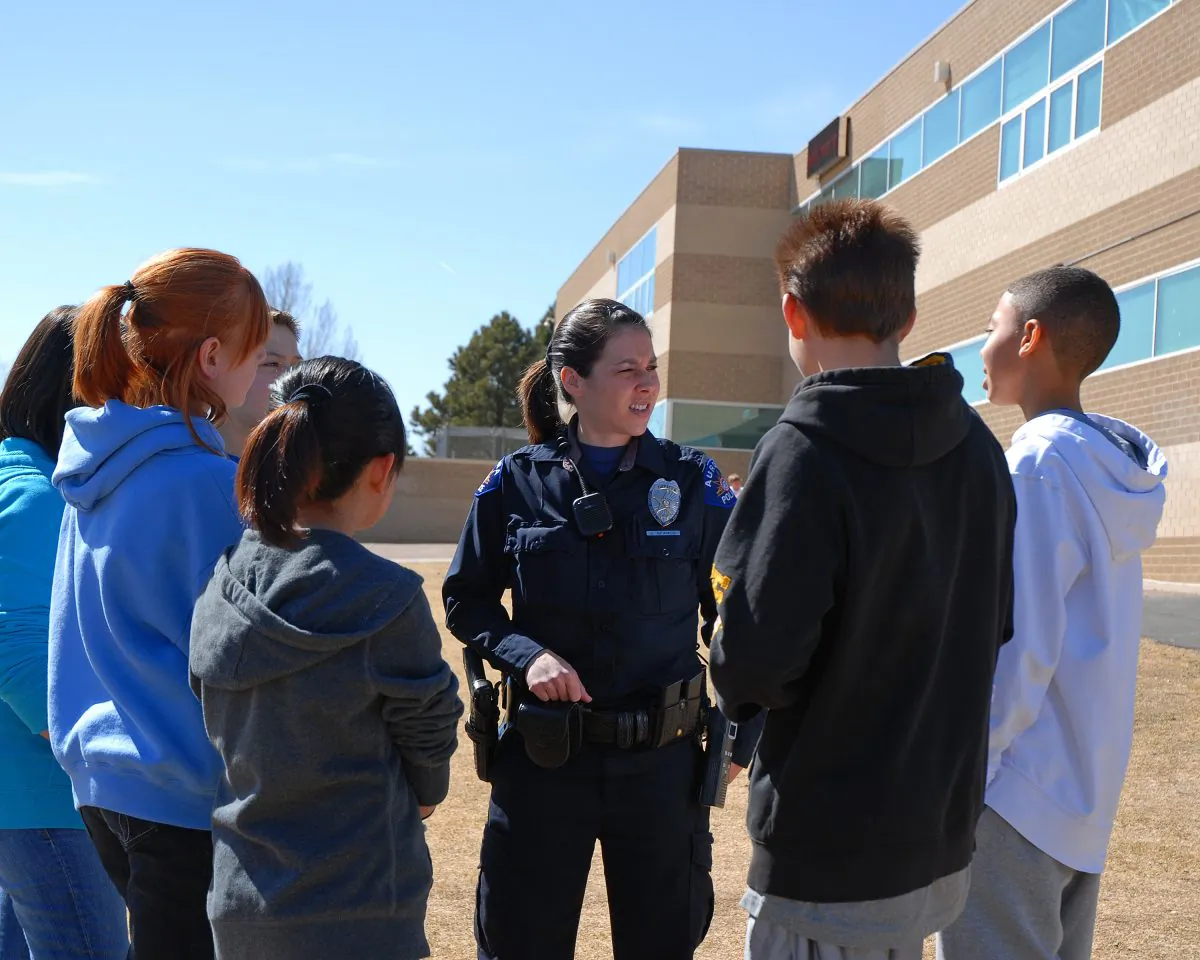 School Resource Officer with students. (Courtesy of Aurora City, Colorado)