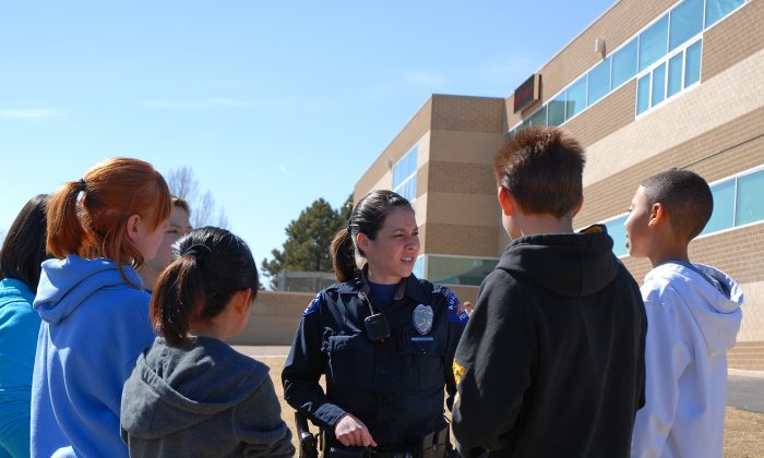 School Resource Officer with students. (Courtesy of Aurora City, Colorado)
