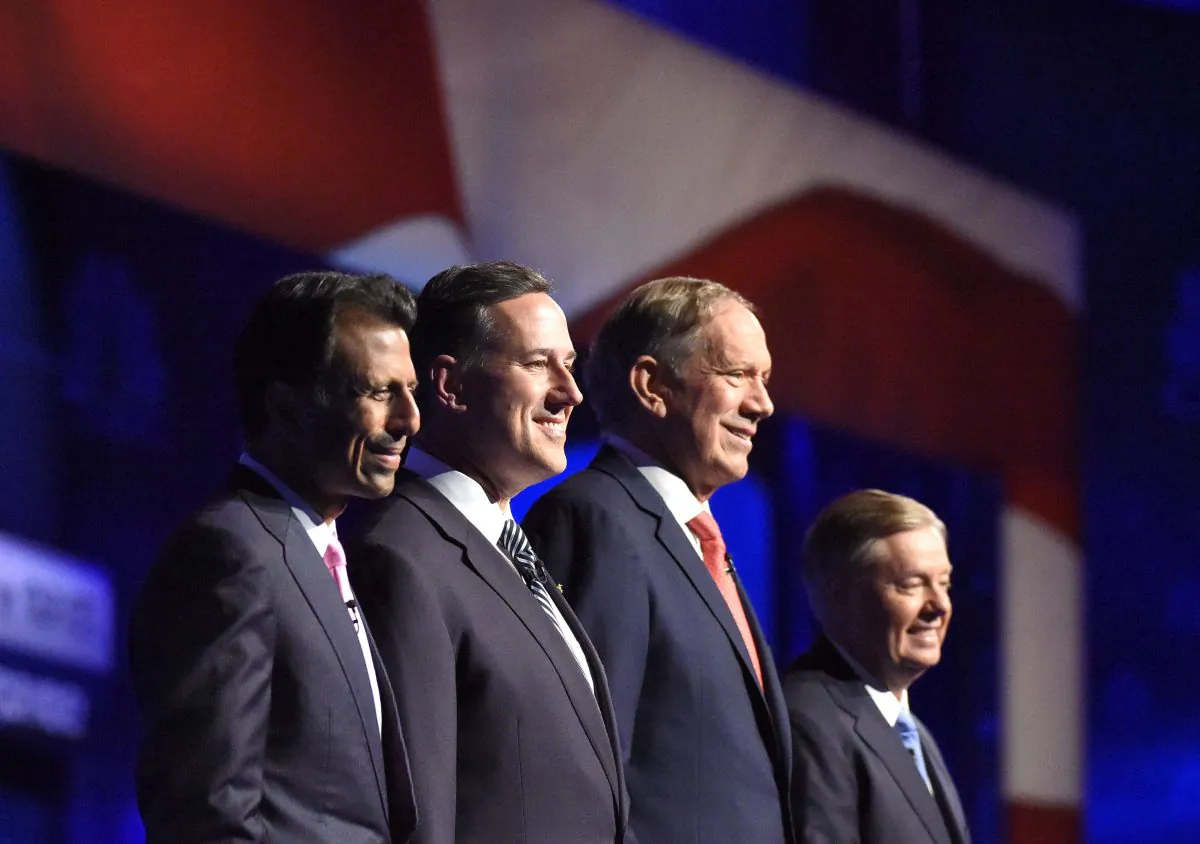 Republican presidential candidates, from left, Bobby Jindal, Rick Santorum, George Pataki, and Lindsey Graham take the stage during the CNBC Republican presidential debate at the University of Colorado, in Boulder, Colo., on Oct. 28, 2015. (Mark J. Terrill/AP Photo)