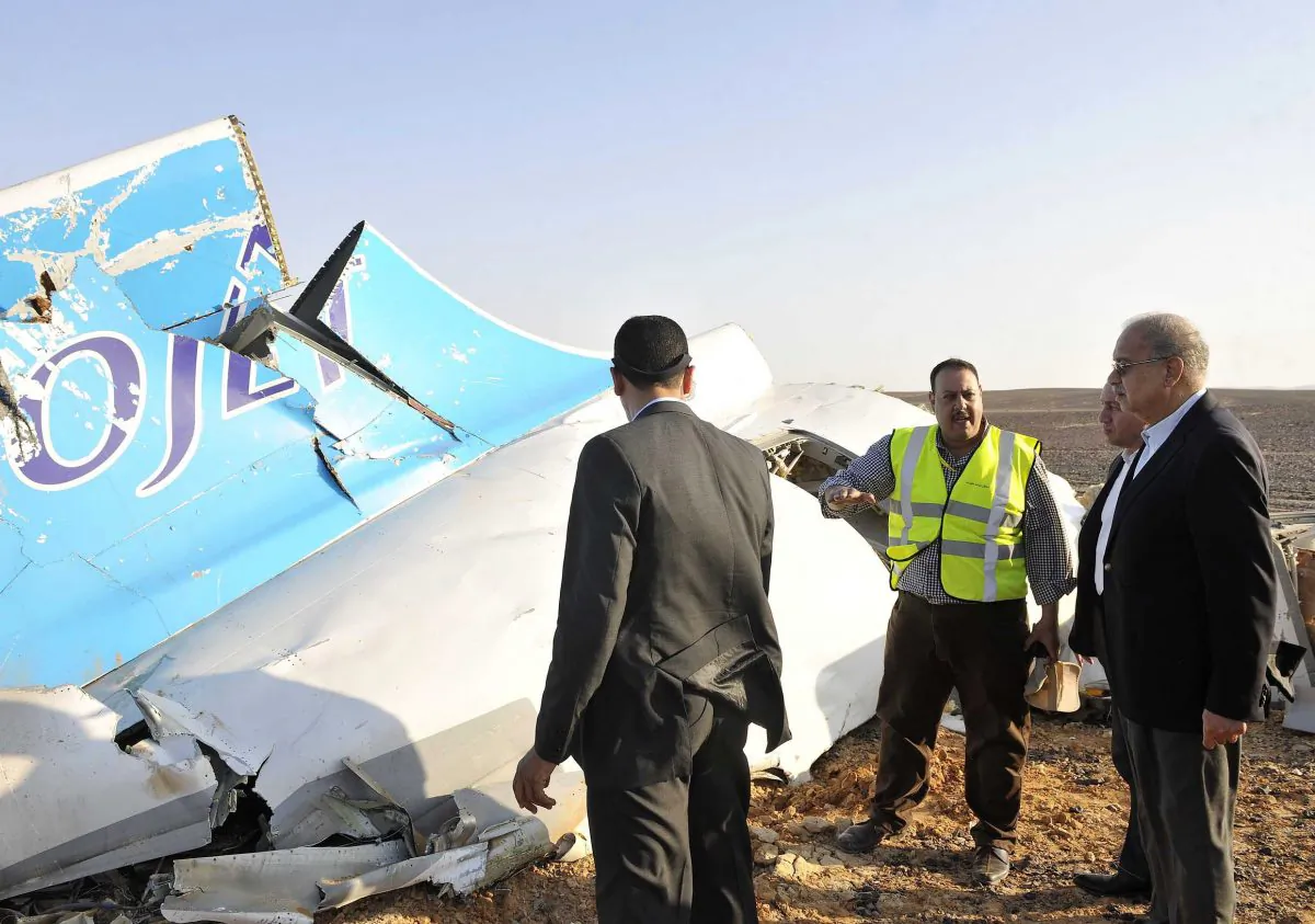 A handout picture released by Egypt's Prime Minister's office on October 31, 2015, shows PM Sherif Ismail (R) at the site of the wreckage of a crashed A321 Russian airliner in Wadi al-Zolomat in Hassana province, a mountainous area of Egypt's Sinai Peninsula. (Seliman Al-Oteifi/AFP/Getty Images)