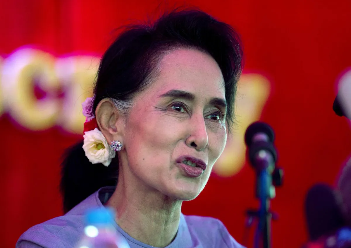 Burma's opposition leader Aung San Suu Kyi addresses the media at a press conference at her home in Yangon, Burma, Thursday, Nov. 5, 2015. (AP Photo/Mark Baker)