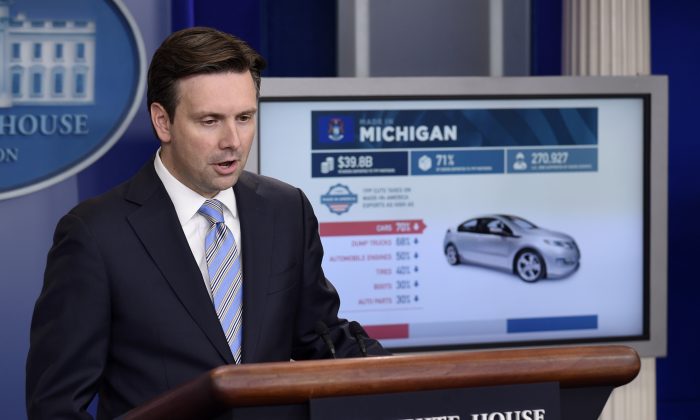 FILE - In this Tuesday, Oct. 13, 2015, file photo, White House press secretary Josh Earnest uses a graphic to discuss the Trans-Pacific Partnership (TPP) during the daily briefing at the White House in Washington.  (AP Photo/Susan Walsh, File)