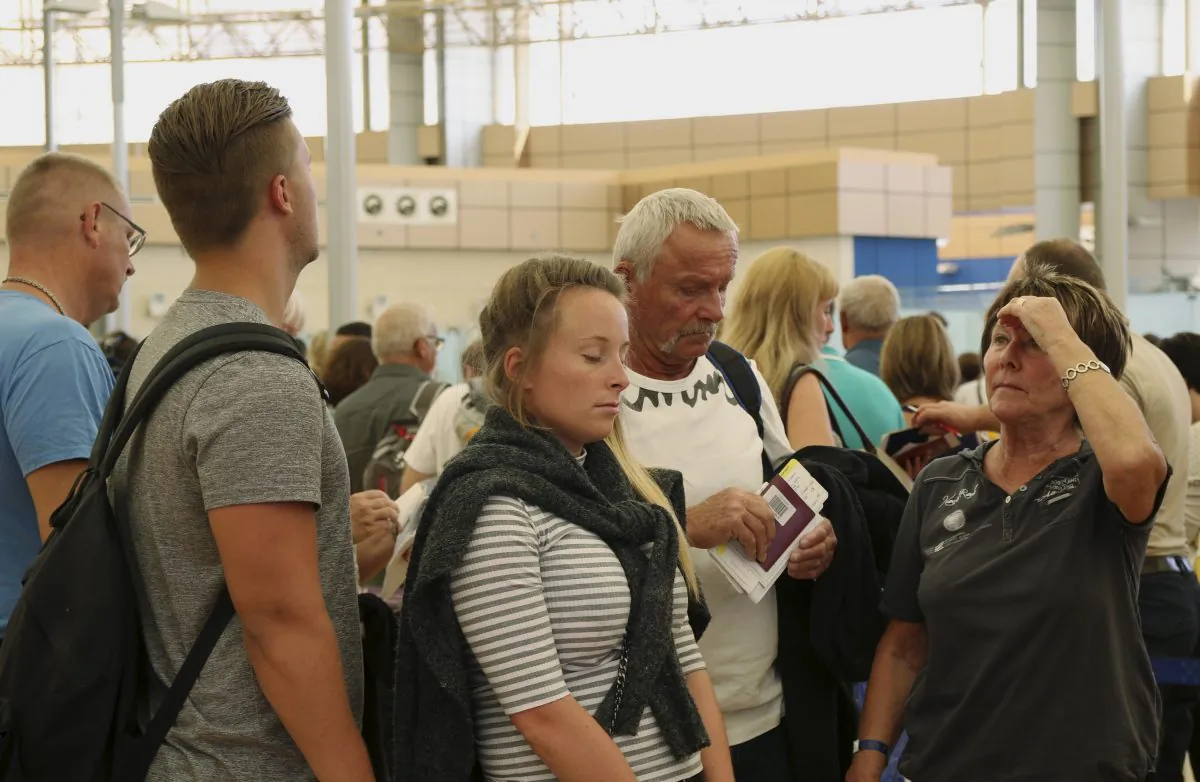 Tourists wait in the departure hall to be evacuated from Sharm el-Sheikh airport, south Sinai, Egypt, Friday, Nov. 6, 2015. (AP Photo/ Vinciane Jacquet)