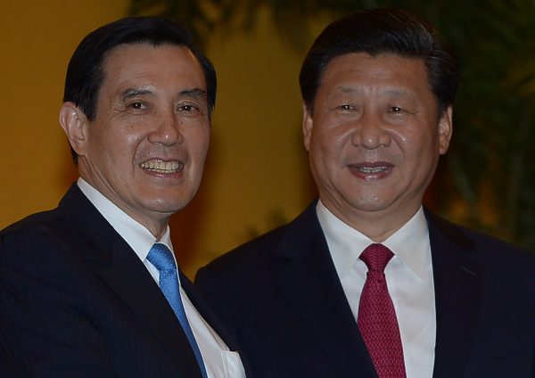 Chinese President Xi Jinping (R) and Taiwanese President Ma Ying-jeou (L) at the Shangri-la Hotel on Saturday, Nov. 7, 2015, in Singapore. The two leaders shook hands at the start of a historic meeting, marking the first top level contact between the formerly bitter Cold War foes since they split amid civil war 66 years ago. (Mohd Rasfan/AFP/Getty Images)