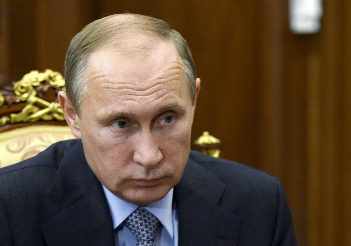 Russian President Vladimir Putin attends a meeting in the Kremlin in Moscow, Russia, Friday, Nov. 6, 2015. Russian President Vladimir Putin agreed to suspend all Russian flights to Egypt on Friday after a recommendation by his chief of intelligence for a halt until the cause of last week's crash of a passenger jet in the Sinai Peninsula is determined, as an official said pieces of wreckage from the plane had been brought to Moscow to test for possible traces of explosives. (Alexei Nikolsky/RIA-Novosti via AP)