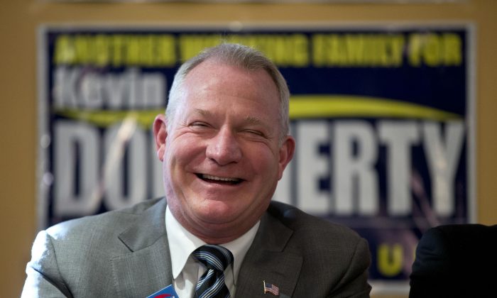 Philadelphia Judge Kevin Dougherty, a Democratic candidate for Pennsylvania Supreme Court, smile during a campaign rally on election day, Tuesday, Nov. 3, 2015, in Philadelphia. (AP Photo/Matt Rourke)