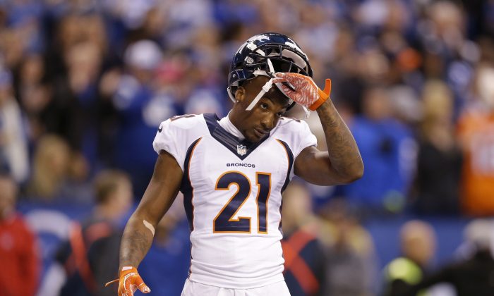 Denver Broncos cornerback Aqib Talib (21) takes off his helmet during the first half of an NFL football game against the Indianapolis Colts, Sunday, Nov. 8, 2015, Indianapolis. (AP Photo/Michael Conroy)
