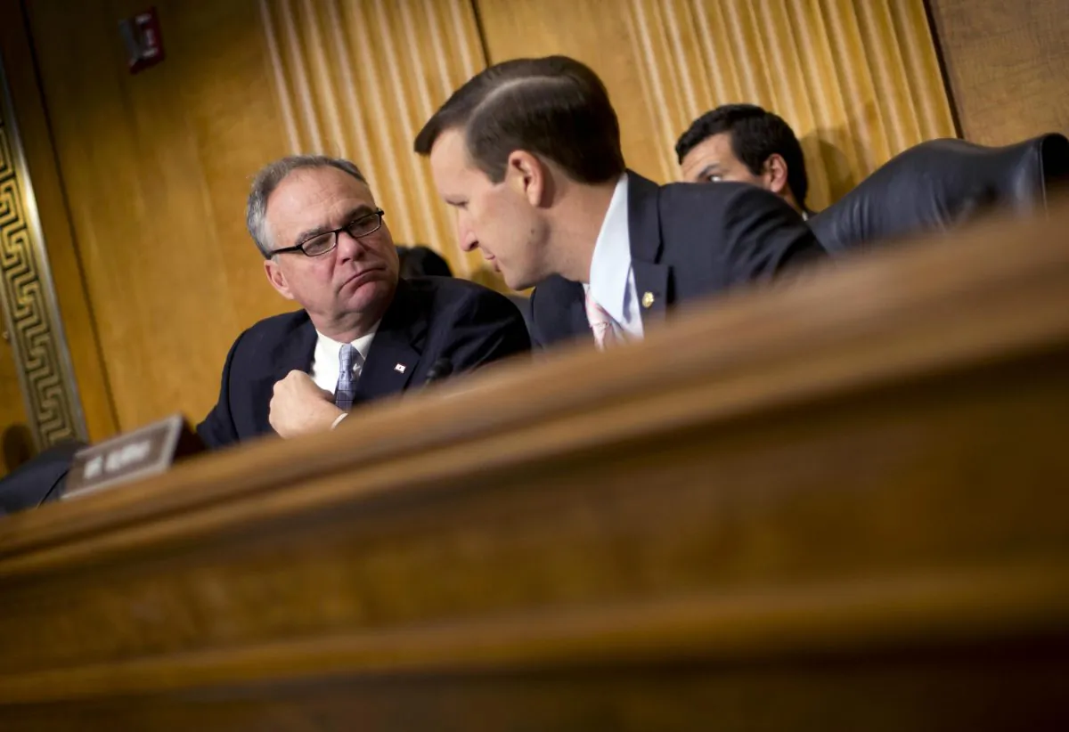 Senate Foreign Relations Committee members, Sen. Tim Kaine (D-Va.) (L) and Sen. Christopher Murphy (D-Conn.), participate in a committee hearing on Capitol Hill in Washington, D.C., on July 9, 2014. In the fight against the Islamic State group, members of Congress talk tough on extremism, but most want nothing to do with voting to legally authorize the military campaign, preferring to let the president take ownership of the mission. (AP Photo/Pablo Martinez Monsivais)