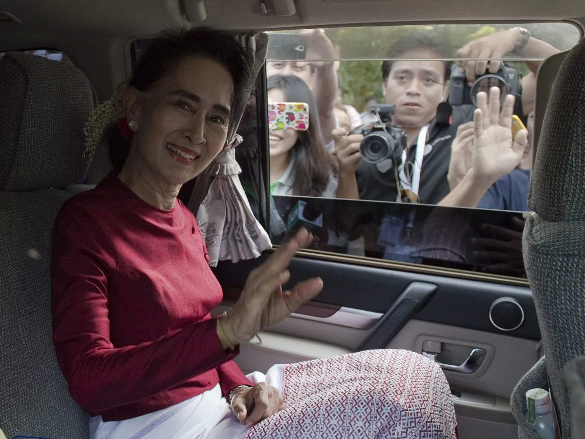 Burma opposition leader and head of the National League for Democracy (NLD) Aung San Suu Kyi leaves her house to cast her vote at a polling station in Yangon on Nov. 8, 2015. The historic poll could see Suu Kyi's opposition launched to power after decades of army rule. (Nicolas Asfouri/AFP/Getty Images)