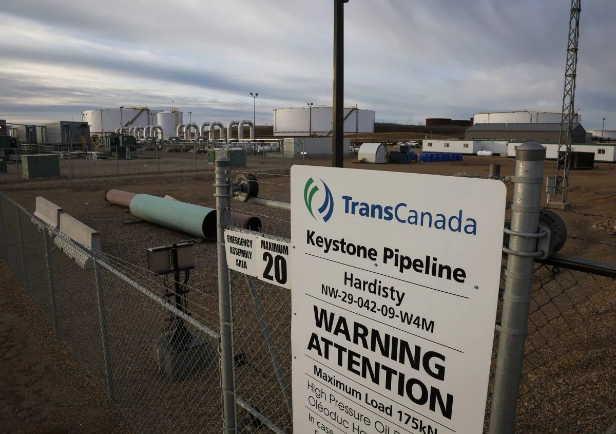 A sign is posted in front of TransCanada's Keystone pipeline facilities in Hardisty, Alberta, Canada, on Nov. 6, 2015. TC Energy Corp., formerly known as TransCanada, said it will go ahead with construction of the US$8-billion Keystone XL Pipeline after Alberta agreed to invest approximately US$1.1 billion as equity in the project. (Jeff McIntosh/The Canadian Press via AP)