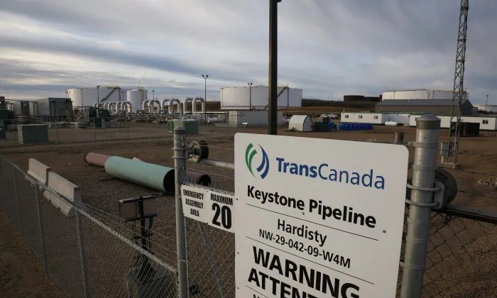 A sign is posted in front of TransCanada's Keystone pipeline facilities in Hardisty, Alberta, Canada, on Nov. 6, 2015. TC Energy Corp., formerly known as TransCanada, said it will go ahead with construction of the US$8-billion Keystone XL Pipeline after Alberta agreed to invest approximately US$1.1 billion as equity in the project. (Jeff McIntosh/The Canadian Press via AP)