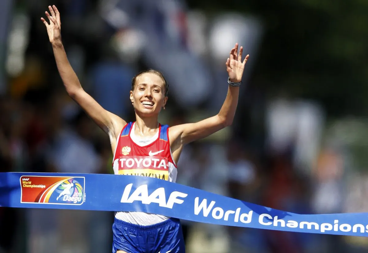 Russia's Olga Kaniskina crosses the finish line to win the Women's 20km Race Walk at the World Athletics Championships in Daegu, South Korea, Aug. 31, 2011.  (AP Photo/Lee Jin-man, file)