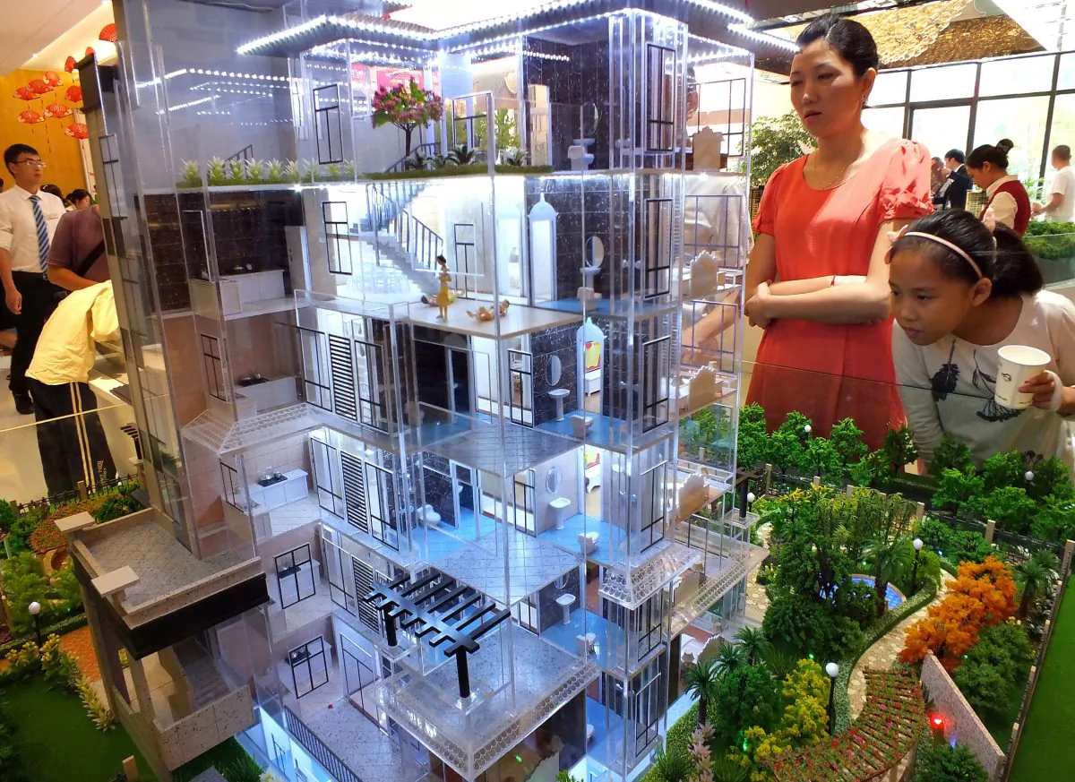 Chinese home buyers visit a housing fair in Yichang, in China's Hubei province on Oct. 1,  2015. (STR/AFP/Getty Images)