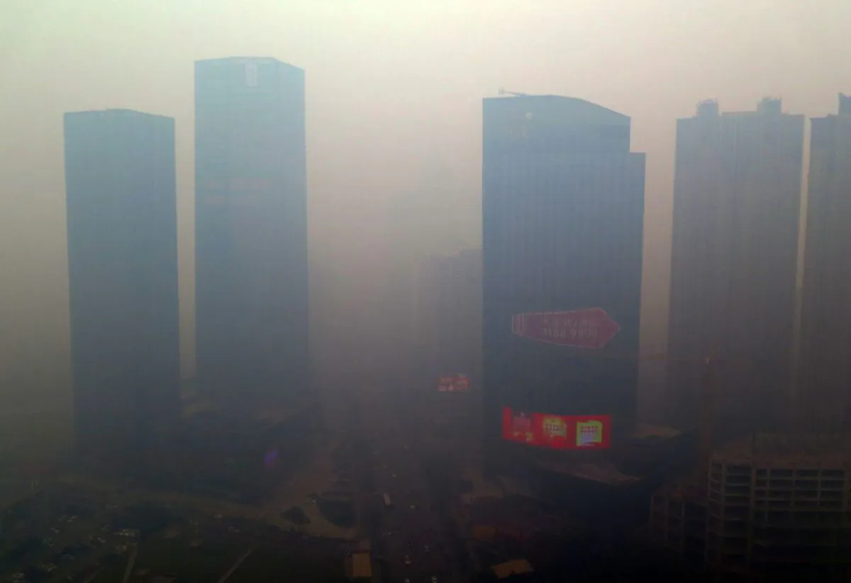 A residential block covered in smog in Shenyang, China's Liaoning Province on Nov. 8, 2015. (STR/AFP/Getty Images)