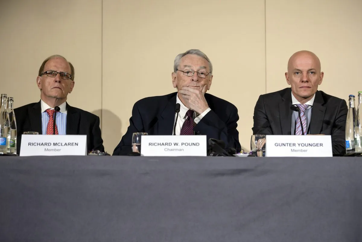 (L-R) Barrister's Solicitor Richard McLaren, former World Anti-Doping Agency (WADA) President and chairman of the WADA independent commission Richard W. Pound, and Head of Department Cybercrime with Bavarian Landeskriminalamt (LKA) Guenter Younger before the press report on corruption and money-laundering within international athletics in Geneva on Nov. 9, 2015. Just 270 days out from the start of the 2016 Rio Olympics, an independent commission set up by the WADA released its findings into a scandal already viewed as more damaging than the corruption crisis engulfing world football governing body FIFA. WADA wants lifetime bans for 5 Russian athletes. (Fabrice Coffrini/AFP/Getty Images)