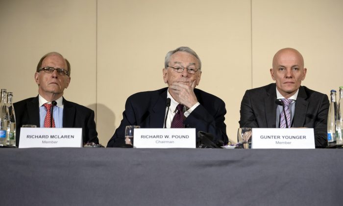 (L-R) Barrister's Solicitor Richard McLaren, former World Anti-Doping Agency (WADA) President and chairman of the WADA independent commission Richard W. Pound, and Head of Department Cybercrime with Bavarian Landeskriminalamt (LKA) Guenter Younger before the press report on corruption and money-laundering within international athletics in Geneva on Nov. 9, 2015. Just 270 days out from the start of the 2016 Rio Olympics, an independent commission set up by the WADA released its findings into a scandal already viewed as more damaging than the corruption crisis engulfing world football governing body FIFA. WADA wants lifetime bans for 5 Russian athletes. (Fabrice Coffrini/AFP/Getty Images)