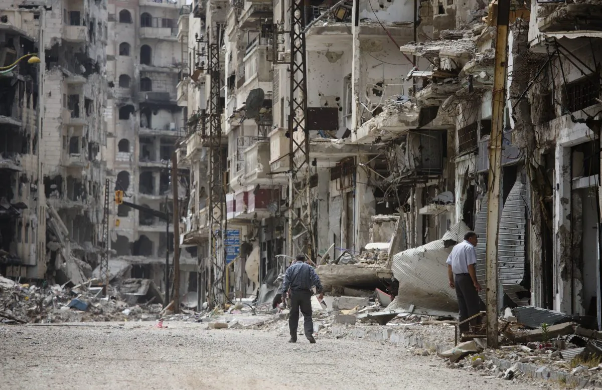 A man walks through a devastated part of Homs, Syria, on June 5, 2014. (AP Photo/Dusan Vranic)