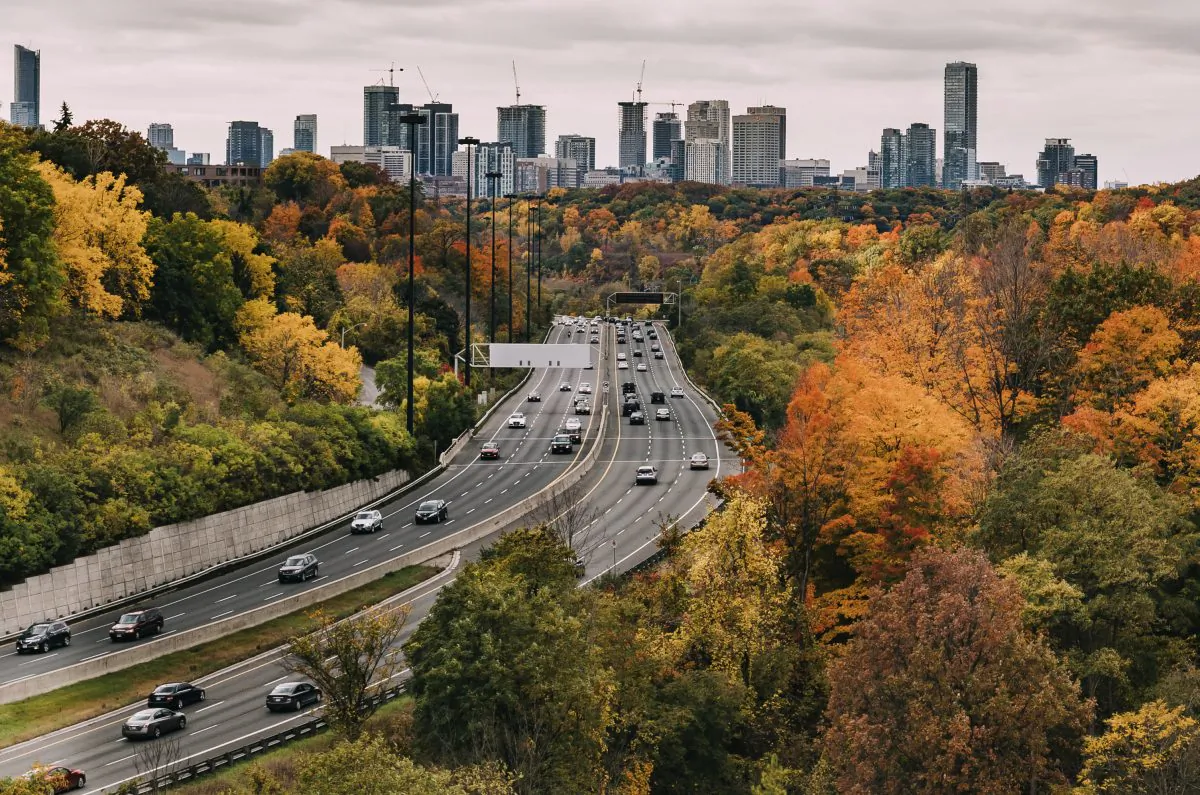 TORONTO, CANADA - 19TH OCTOBER 2014: Cars on the Don Valley Highway in Toronto during the Fall. The city can be seen in the distance.