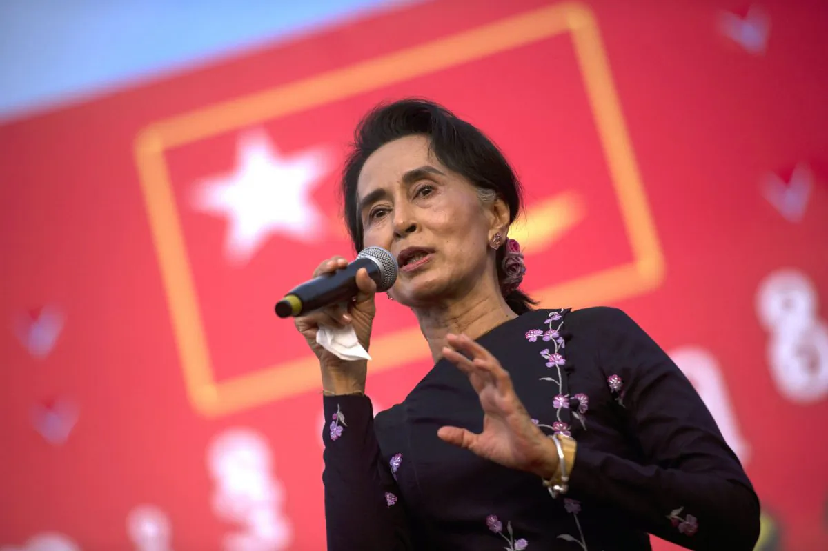 Aung San Suu Kyi speaks onstage during a campaign rally for the National League for Democracy in Yangon on Nov. 1, 2015. (Ye Aung Thu/AFP/Getty Images)