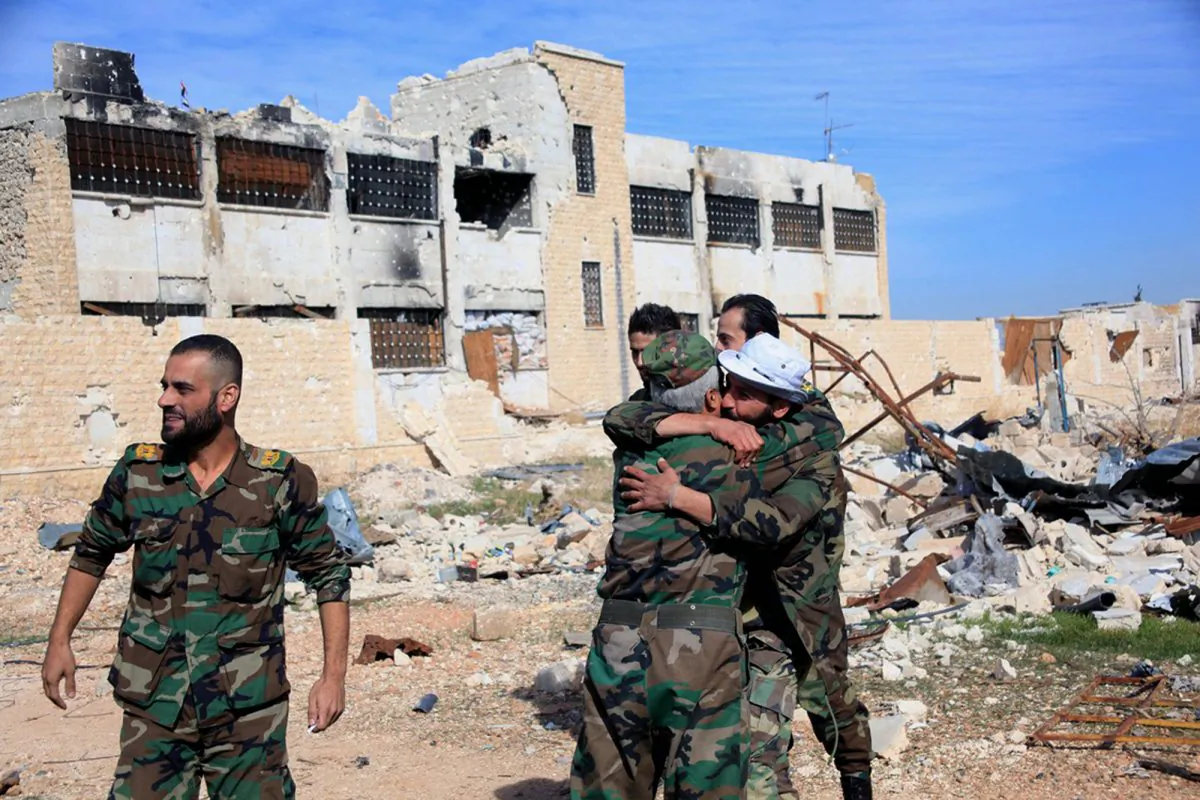 Syrian government troops hug each other in celebration inside the Kweiras air base, east of Aleppo, Syria, Wednesday, Nov. 11. (SANA via AP)