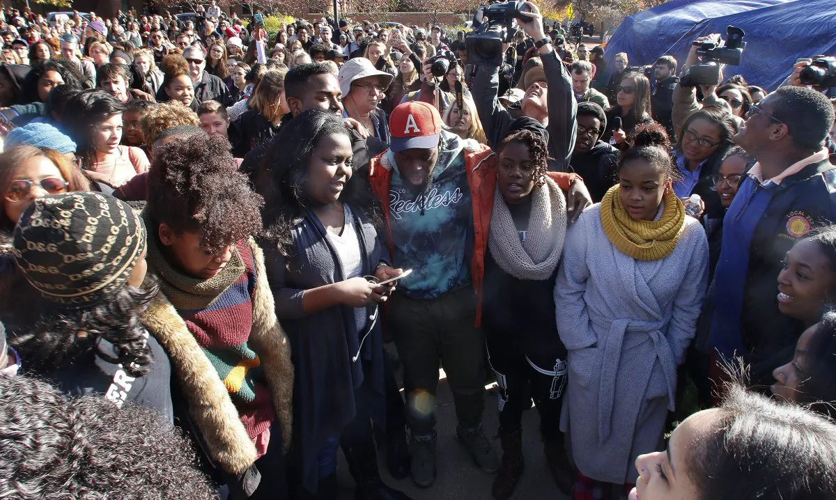Supporters gather after the announcement that University of Missouri System President Tim Wolfe would resign Monday, Nov. 9, 2015, in Columbia, Mo. (Matt Hellman/Missourian via AP)