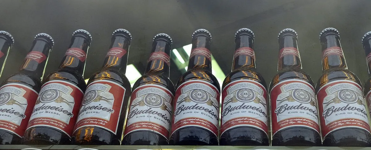Bottles of Budweiser beer in a shop window in London on Oct. 13, 2015. Like Bud Light, Budweiser has also seen a recent drop in sales. (AP Photo/Kirsty Wigglesworth)