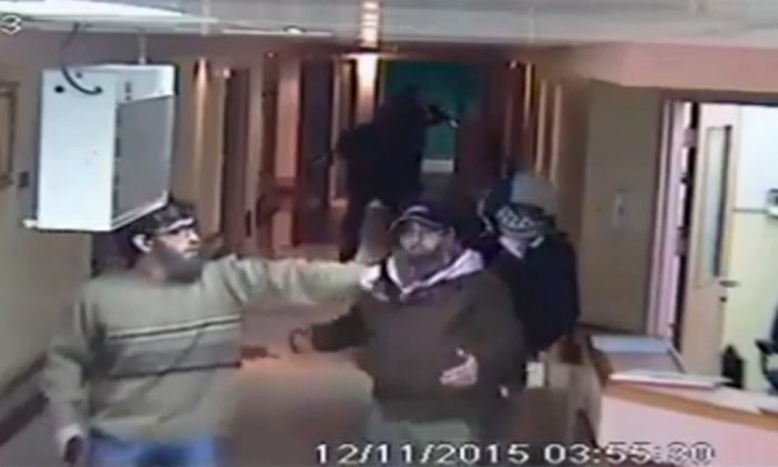 This image made from CCTV video released by Al-Ahli Hospital shows an arrest raid seeking a stabbing suspect by Israeli forces disguised in fake beards in Hebron on Thursday, Nov. 12, 2015. (Al-Ahli Hospital via AP) 