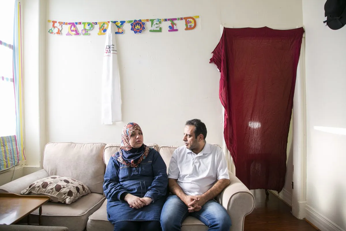 Syrian refugees Hussam Al Roustom and his wife Suha in their home in Jersey City, New Jersey, on Nov. 9, 2015. They left Homs, Syria in 2013 with their two small children. (Samira Bouaou/Epoch Times)