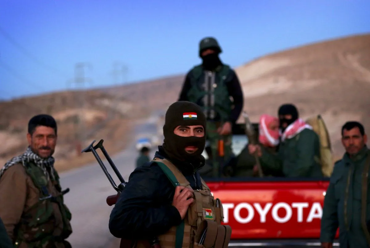 Iraqi Kurdish forces take part in an operation backed by U.S.-led airstrikes in the northern Iraqi town of Sinjar, Mosul Province, on Nov. 12, 2015, to retake the town from the Islamic State and cut a key supply line to Syria. (Safin Hamed/AFP/Getty Images)