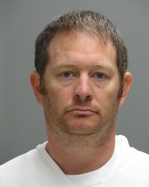 This booking photo provided by the Delaware Department of Justice shows Lee Robert Moore. Federal authorities say Moore, a Secret Service agent from Maryland, sent obscene images and texts to someone he thought was a young Delaware girl, sometimes doing it while on duty at the White House. (Delaware Department of Justice via AP) MANDATORY CREDIT