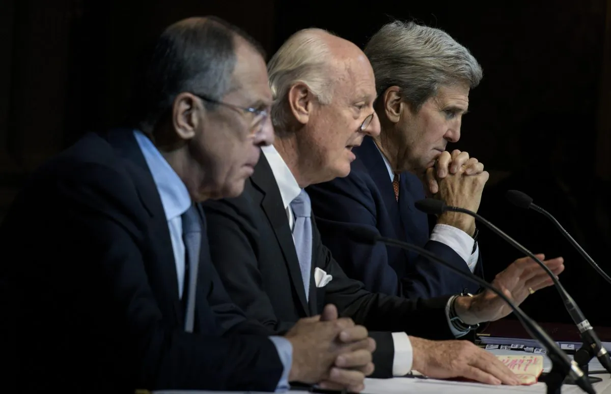 (L-R) Russian Foreign Minister Sergei Lavrov, U.N. Special Envoy for Syria Staffan de Mistura, and U.S. Secretary of State John Kerry at a press conference at the Grand Hotel in Vienna, Austria, on Oct. 30, 2015. (Brendan Smialowski/AFP/Getty Images)