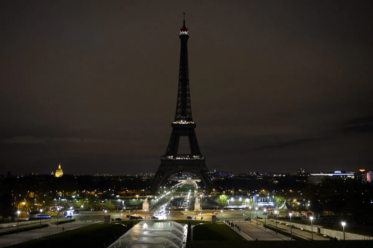 The Eiffel Tower with its lights turned off following the deadly attacks in Paris on Nov. 14, 2015. Islamic State jihadists claimed a series of coordinated attacks by gunmen and suicide bombers in Paris that killed at least 129 people in scenes of carnage at a concert hall, restaurants and the national stadium. (Alain Jocard/AFP/Getty Images)