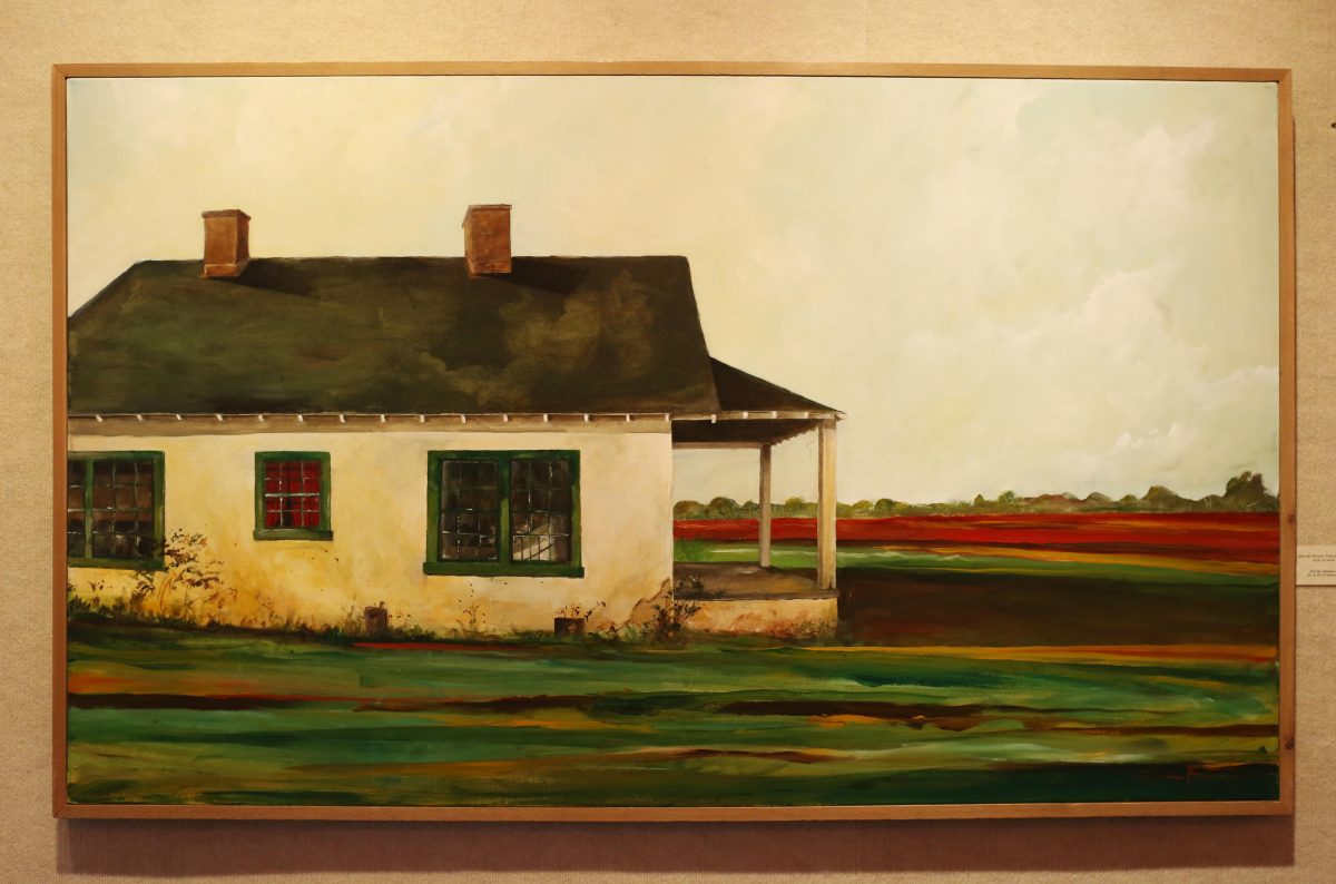 In this photo taken Nov. 3, 2015, Samuel W. Barnett art piece hangs in the Kennedy Douglass Center for the Arts in Florence, Ala. Barnett, a Tuscumbia native living in Decatur, takes pictures of barns and sharecropper houses and turns them into paintings, capturing many old buildings that are no longer standing. (Allison Carter/The TimesDaily via AP)