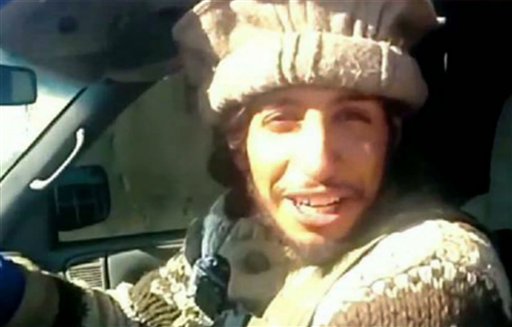 This undated image taken from a Militant Website on Monday Nov. 16, 2015 showing Belgian Abdelhamid Abaaoud. A French official says Abdelhamid Abaaoud is the suspected mastermind of the Paris attacks was also linked to thwarted train and church attacks. (Militant video via AP)