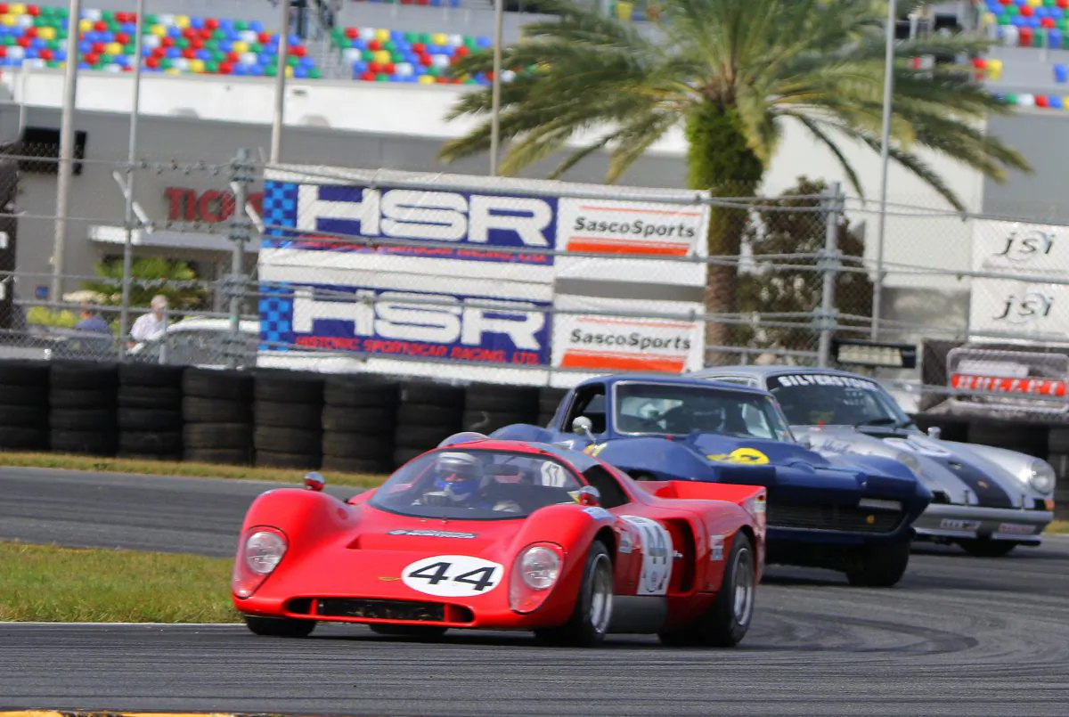 This is what makes the Classic 24 so amazing: tight competition between a wide variety of strikingly beautiful, historically important cars. Here Gray Gregory and Randy Buck’s #44 1971 Chevron B16 leads the #17 1964 Corvette of Brian and Spencer Trenery and the #76 1972 Porsche 911 of Tom O’Callaghan and Bruce Ellsworth around Turn Three in the infield of Daytona International Speedway during the first Group A race during the HSR Classic 24, Nov. 14. (Chris Jasurek/Epoch Times)