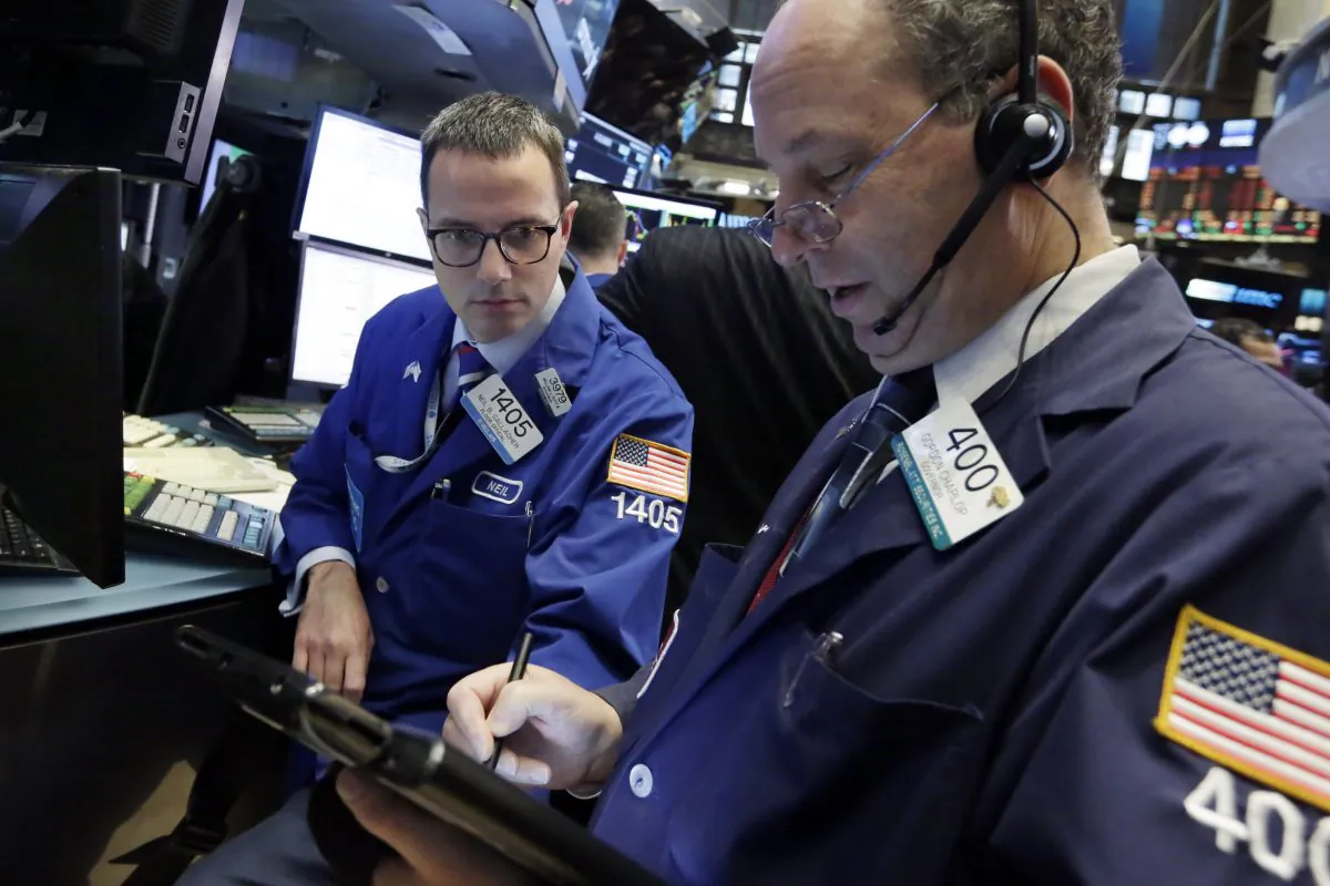 Specialist Neil Gallagher (L) and trader Gordon Charlop work on the floor of the New York Stock Exchange, Monday, Nov. 16, 2015. (AP Photo/Richard Drew)