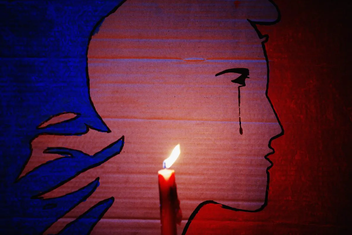 A candle burns during a vigil in Aotea Square to remember victims of the Paris attacks in Auckland, New Zealand, on Nov. 14, 2015. (Hannah Peters/Getty Images)