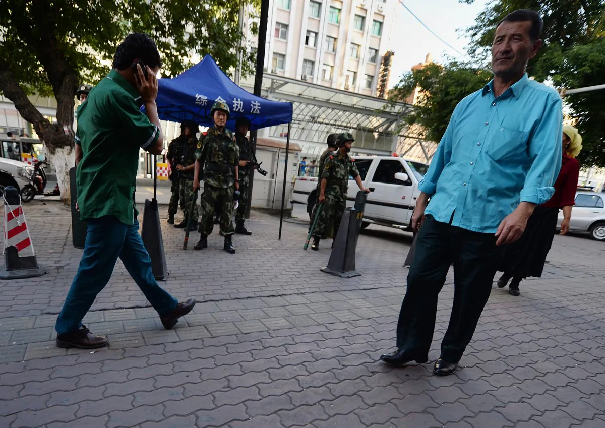 Chinese paramilitary police stand guard in the Muslim Uyghur minority area of Urumqi, Xinjiang Province, China on June 30, 2013. (Mark Ralston/AFP/Getty Images)