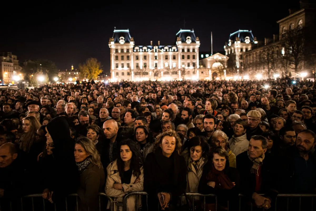 People gather outside of Notre Dame Cathedral on Nov. 15, 2015, ahead of a ceremony to the victims of the Friday's terrorist attacks in Paris, France. (David Ramos/Getty Images)