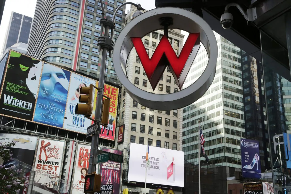 The logo for the W Hotel, owned by Starwood Hotels & Resorts Worldwide, is seen in New York's Times Square on July 31, 2013. Marriott International announced Monday, Nov. 16, 2015, it is buying rival hotel chain Starwood for $12.2 billion in a deal that will secure its position as the world's largest hotelier. (AP Photo/Mark Lennihan)