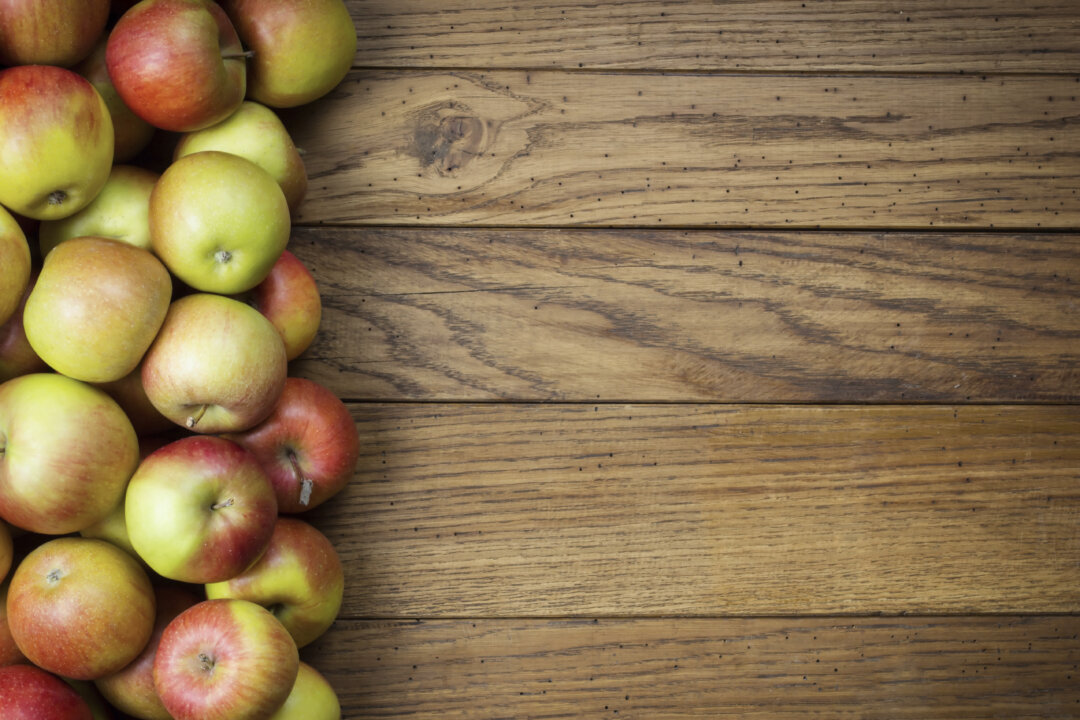 Apples on wooden background