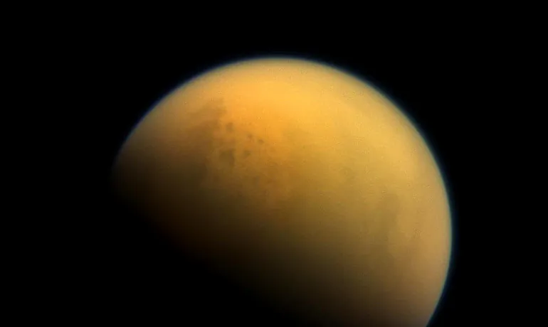 Astronomers often think of Earth-like exoplanets as "pale blue dots, but with this haze, Earth would have been a 'pale orange dot'," says Giada Arney. Above, an image of Saturn's haze-shrouded moon Titan taken by the Cassini spacecraft. (Credit: NASA)