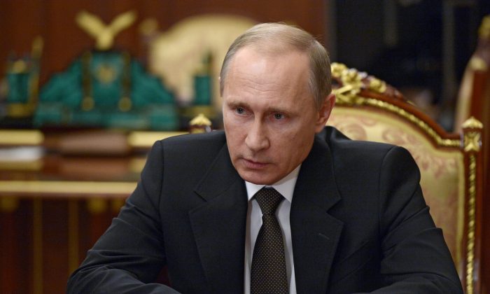 Russian President Vladimir Putin heads a meeting in Moscow's Kremlin, Russia, on Nov. 17, 2015. (Alexei Nikolsky/Sputnik, Kremlin Pool via AP)