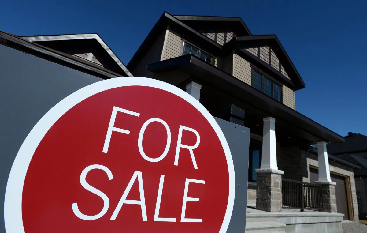 A sign advertises a new home for sale in Carleton Place, Ontario in this file photo. (The Canadian Press/Sean Kilpatrick)