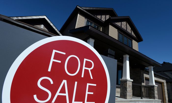 A sign advertises a new home for sale in Carleton Place, Ontario in this file photo. At the national level, home sales have almost reached a peak for six years. (The Canadian Press/Sean Kilpatrick)