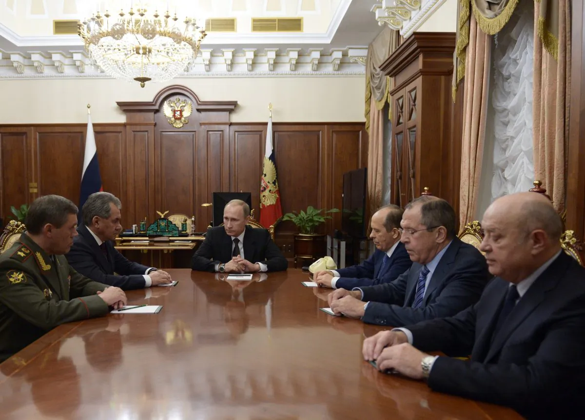 (L-R) Head of General Staff, Gen. Valery Gerasimov, Defense Minister Sergei Shoigu, Russian President Vladimir Putin, Federal Security Service (FSB) head Alexander Bortnikov, Foreign Minister Sergey Lavrov, and Foreign Intelligence Service head Mikhail Fradkov at a meeting on the Russian plane crash in Egypt, in Moscow's Kremlin, Russia, on Nov. 17, 2015. The head of Russia's FSB security service says the crash of the passenger plane in Egypt was the result of a 'terrorist' act. Alexander Bortnikov told President Vladimir Putin on Tuesday that a homemade explosive device blew up on the plane. (Alexei Nikolsky/Sputnik via AP)