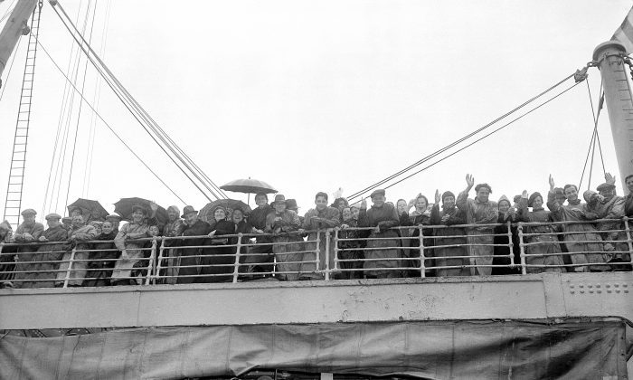 Jewish refugees from Britain get their first glimpse of North America as they dock at Halifax, Nova Scotia, Canada, on June 19, 1940. They are enroute to New York City to make a new life. (AP Photo)