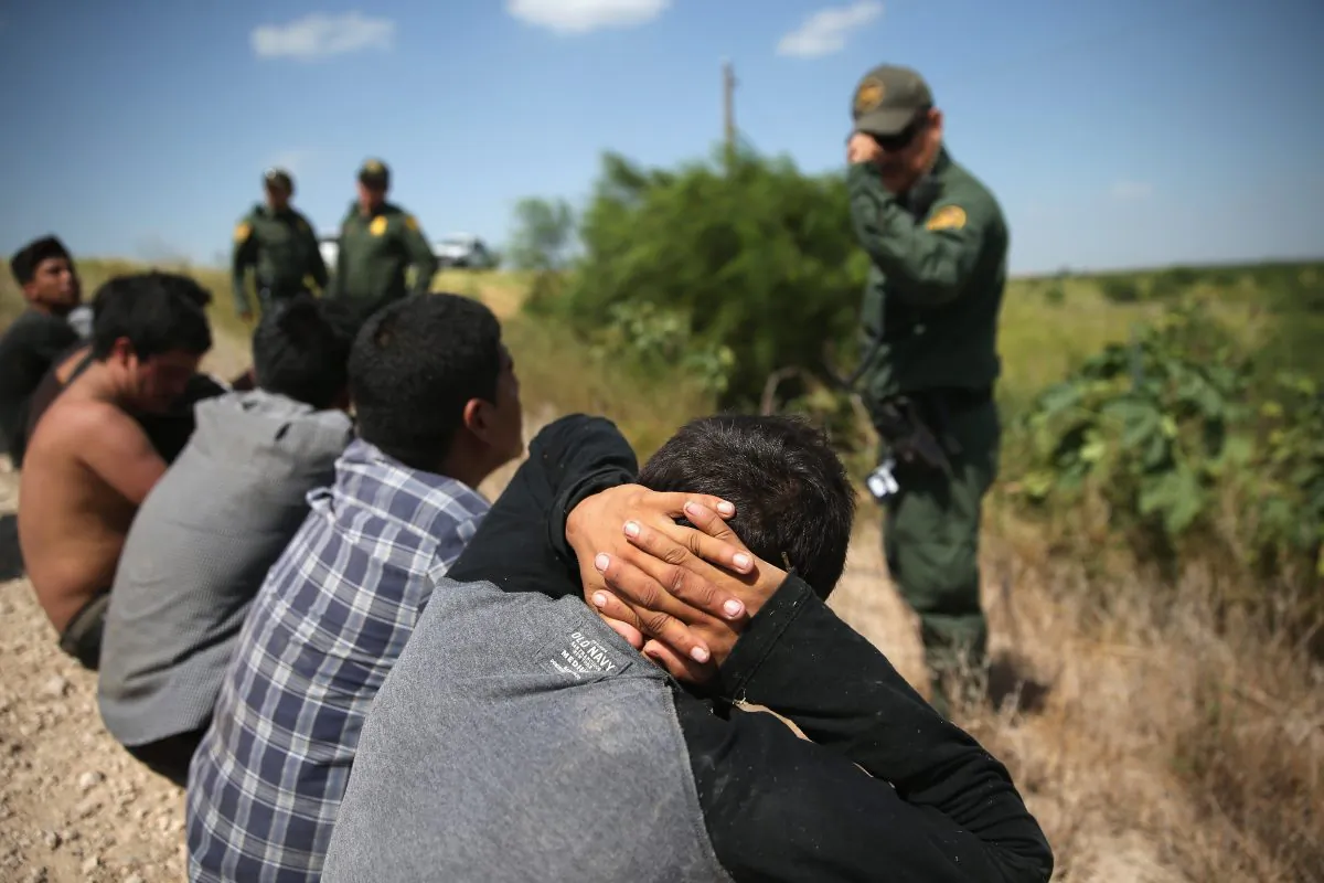Border Patrol agents detain illegal immigrants after they crossed the border from Mexico into the United States in McAllen, Texas, on Aug. 7, 2015. The state's Rio Grande Valley corridor is the busiest illegal border crossing into the United States. Border security and immigration have become major issues in the U.S. presidential campaigns. (John Moore/Getty Images)