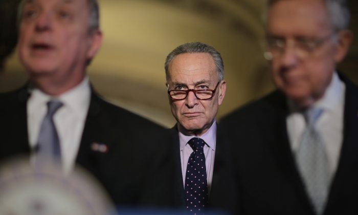 Sen. Charles Schumer (D-N.Y.) (C) joins Senate Minority Whip Richard Durbin (D-Ill.) (L) and Senate Majority Leader Harry Reid (D-N.V.) following the weekly Senate Democratic policy luncheon at the U.S. Capitol in Washington, on Nov. 17, 2015. (Chip Somodevilla/Getty Images)